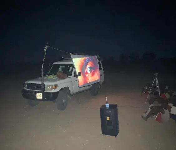 Truck with Jesus film set up and showing on the side